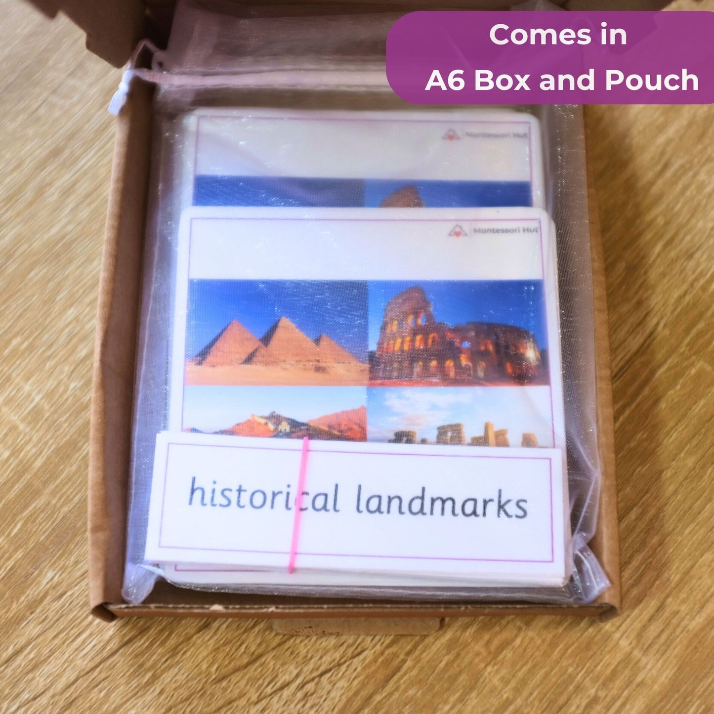 Packaging of educational flashcards featuring historical landmarks with text 'historical landmarks' on a wooden surface.