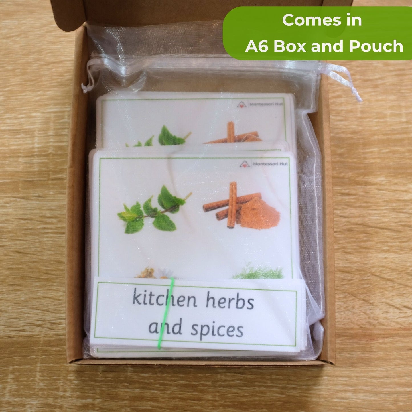 Card set titled 'Kitchen Herbs and Spices' in an A6 box and pouch on a wooden surface.