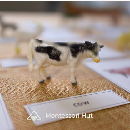 Cow figure standing next to its name label "cow"
