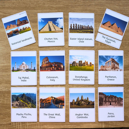 Set of cards with images and names of famous landmarks on a wooden surface